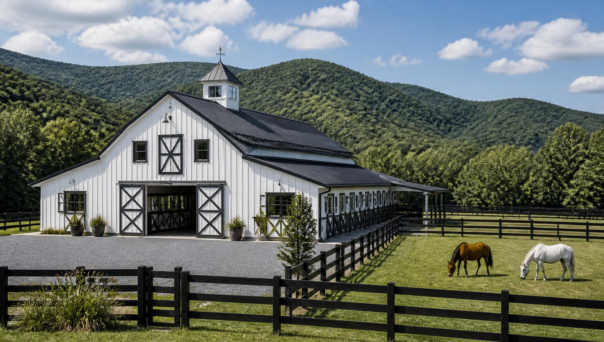 Equestrian Property Development in North Georgia in North Georgia — White horse barn with fenced paddocks on a North Georgia equestrian property